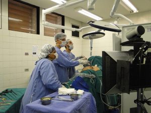 urologists performing surgery on a patient